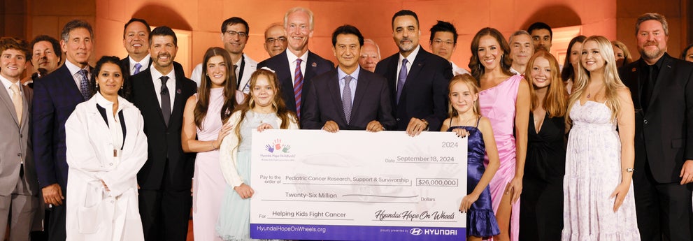 helping kids fight cancer foundation showing their big check from hyundai hope on wheels - Fremont Hyundai in Fremont CA